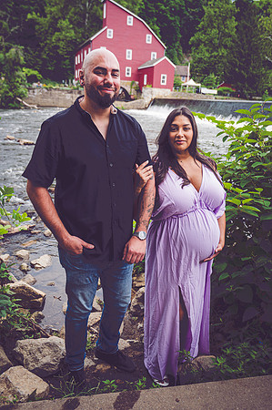 Newborn portrait with a touch of nature, food, and bokeh effect, captured at the Clinton studio.
