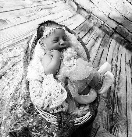 Colorful newborn session at Clinton studio with a smile.