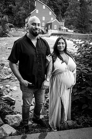Black and white bridal couple portrait featuring a maternity profile.