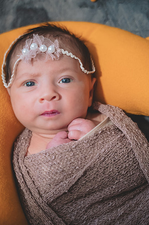 Newborn portrait with eyes open, captured at the Clinton studio.