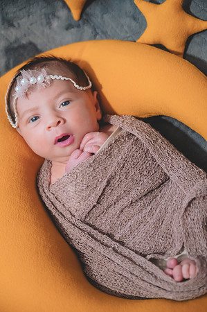 High key black and white portrait of a newborn with eyes open at the Clinton studio.
