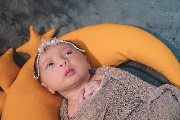 Maternity portrait of a smiling couple, showing a profile view.