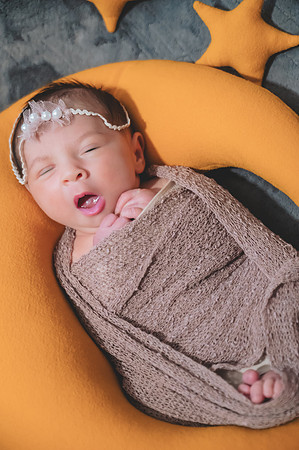 Another bokeh portrait of a newborn with eyes open at the Clinton studio.