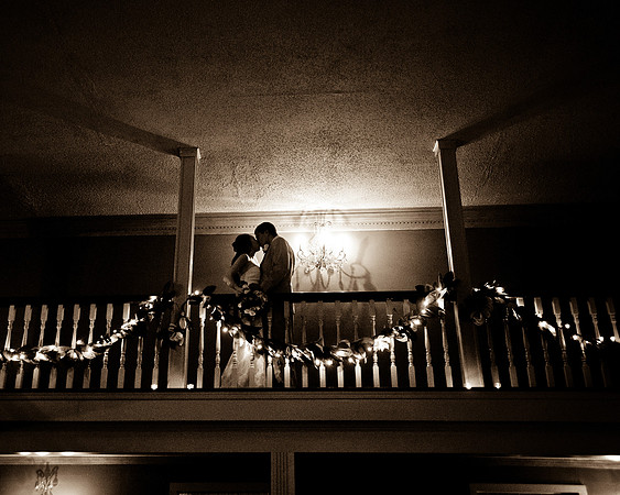 bride and groom kissing on balcony by NJ Wedding Photographer