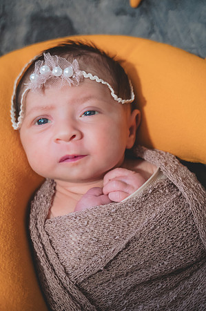 Another high key black and white portrait of a newborn with eyes open at the Clinton studio.