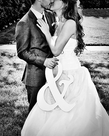 bride and groom holding ampersand black and white by NJ Wedding Photographer