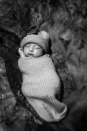 Another black and white newborn portrait of two faces sitting at the Clinton studio.