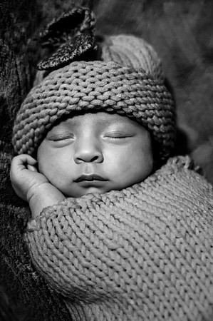 Colorful portrait of two newborns with eyes open, captured at the Clinton studio.