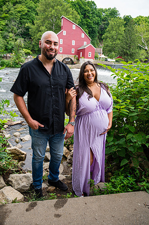 Another black and white maternity portrait of a smiling female in profile view.
