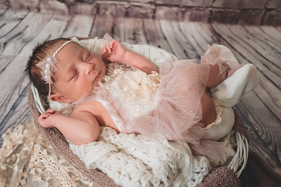 Colorful newborn portrait with blond hair at Clinton studio.