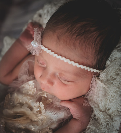 Colorful newborn portrait at Clinton studio with eyes open.
