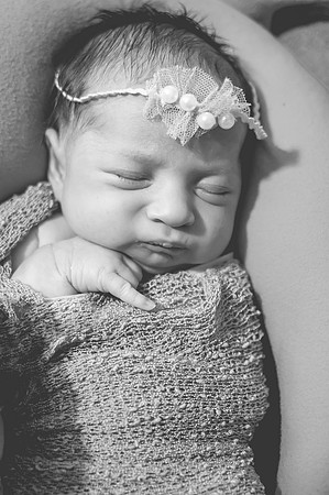 Colorful portrait of two newborns with eyes open, captured at the Clinton studio.