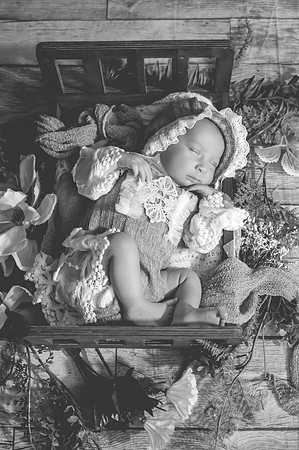 Black and white newborn portrait at Clinton studio with eyes open.