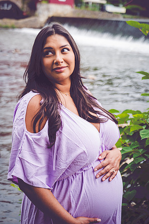 Portrait of a smiling pregnant female.