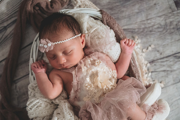 Newborn session at Clinton studio featuring a smiling male child.