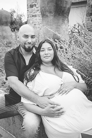 Maternity profile portrait by a waterfall with complementary colors.
