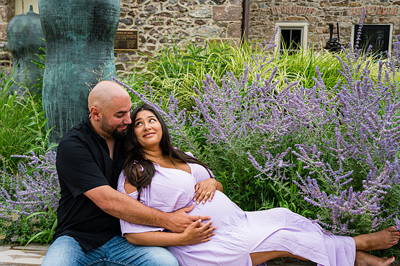 Colorful newborn portrait at Clinton studio featuring a kneeling pose.