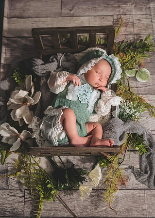 Black and white newborn portrait at Clinton studio with eyes open.