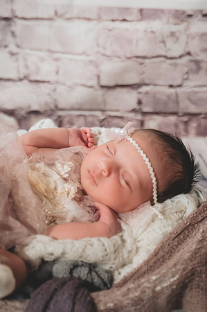High key black and white newborn portrait at Clinton studio with eyes open.