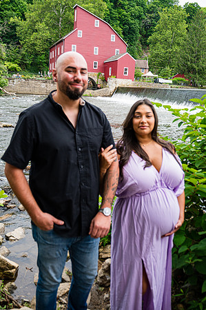Maternity portrait of a bride and groom with blond hair.