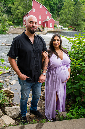 Wedding maternity portrait of a bride and groom at the studio.